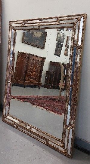 MIROIR bisauté à parecloses et bois doré...