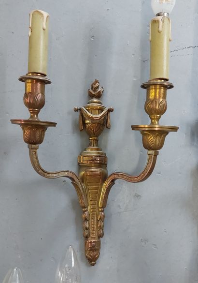 TWO PAIRS OF APPLIQUES in gilded and chased...