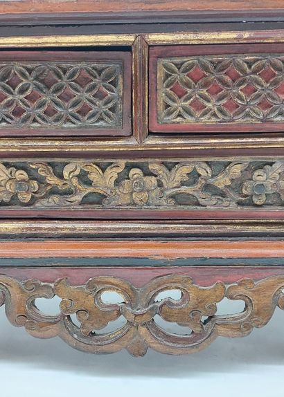 SMALL CABINET in gilded, carved and red lacquered...