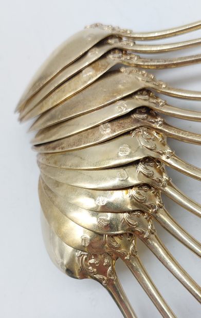 TWELVE SMALL GOLDEN SPoons with coat of arms
Weight...