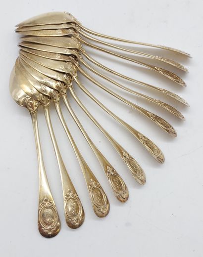 TWELVE SMALL GOLDEN SPoons with coat of arms
Weight...