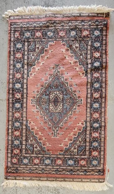 THREE HAND-MADE WOLF RUGS FROM THE EAST
-...
