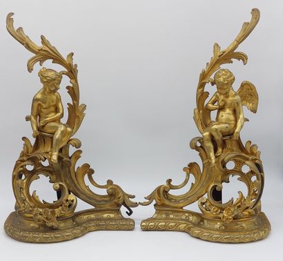 IMPORTANT PAIR OF CHENETS in gilded and chased...