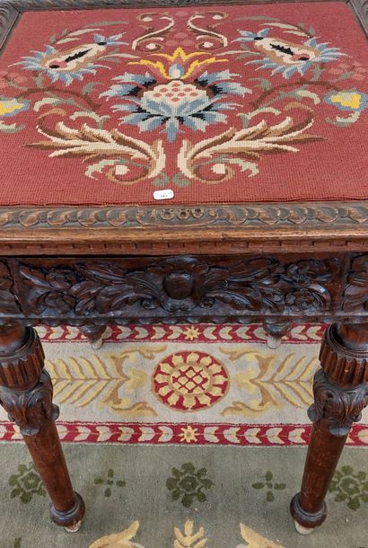 TABLE DE SALON in richly carved wood, dated...