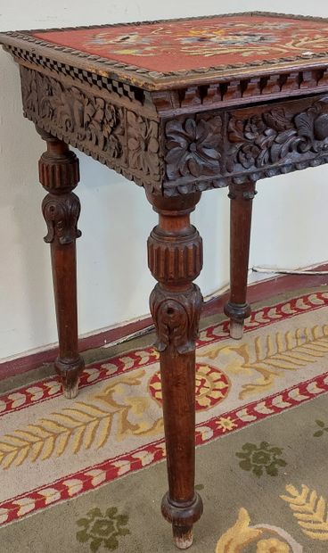 TABLE DE SALON in richly carved wood, dated...