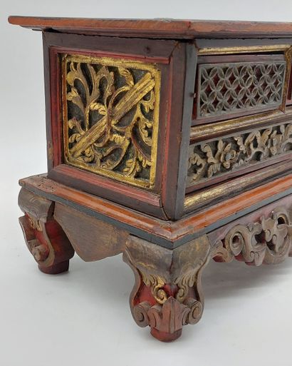 SMALL CABINET in gilded, carved and red lacquered...