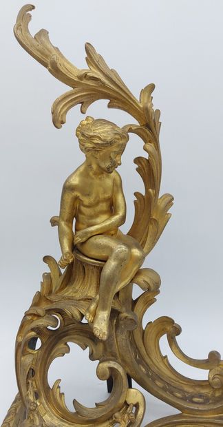 IMPORTANT PAIR OF CHENETS in gilded and chased...