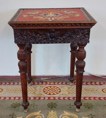 TABLE DE SALON in richly carved wood, dated...
