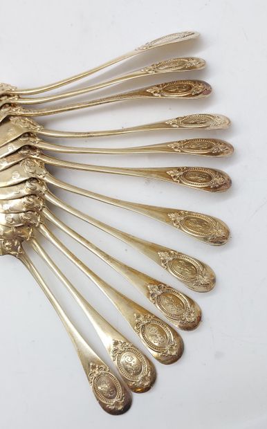 TWELVE SMALL GOLDEN SPoons with coat of arms
Weight...