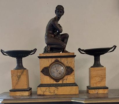 Mantelpiece including a chased marble clock...
