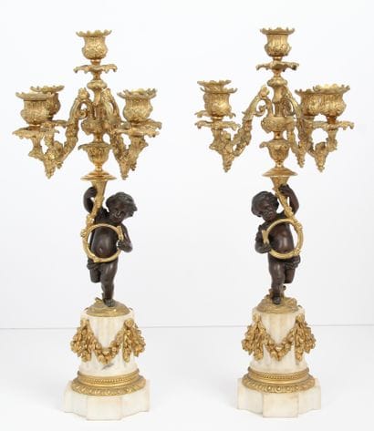 PAIRE DE CANDÉLABRES

En bronze doré et bronze...