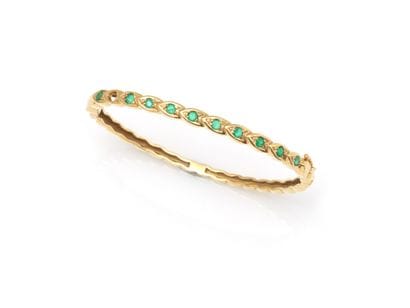 BRACELET
retenant une ligne d'émeraudes (manque...