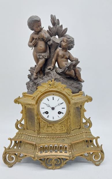 Gilded and patinated regule CLOCK, topped...