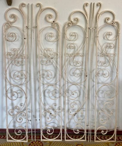 SET OF FOUR white-painted wrought-iron GRATES

With...