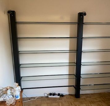three shelves, black metal frame and glass...