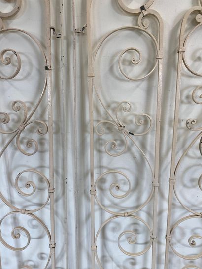 SET OF FOUR white-painted wrought-iron GRATES

With...