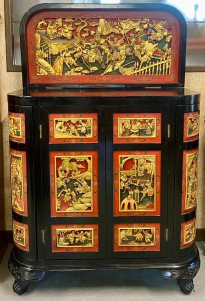 CHINA

Richly carved lacquered wood bar cabinet...
