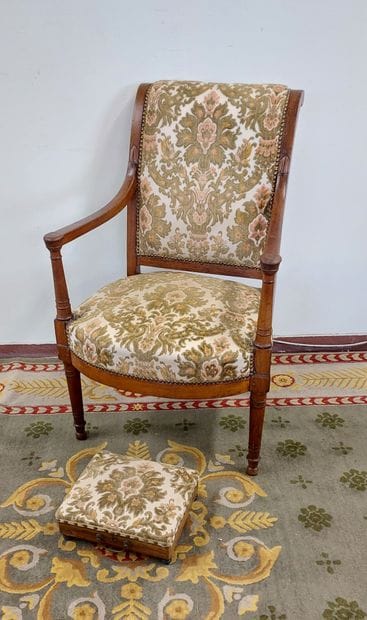 Natural wood armchair upholstered in floral...