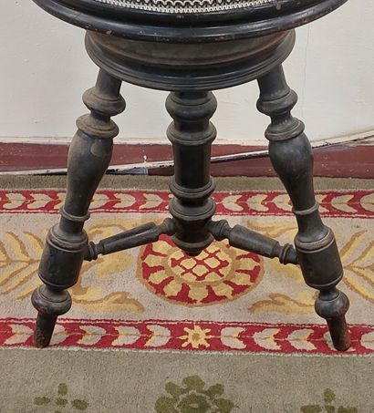PIANO TABOURET in blackened wood, seat upholstered...
