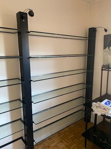 three shelves, black metal frame and glass...