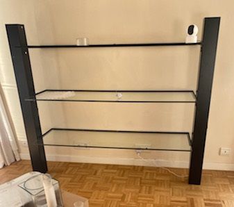 three shelves, black metal frame and glass...