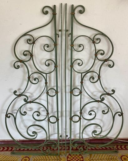PAIR OF GREEN PAINTED WROUGHT IRON GRATES

With...
