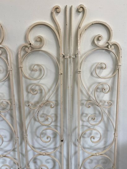 SET OF FOUR white-painted wrought-iron GRATES

With...