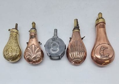 LOT OF FIVE POWDER TANKS in repoussé copper...
