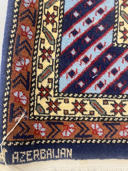Handmade wool carpet with geometric design

166...