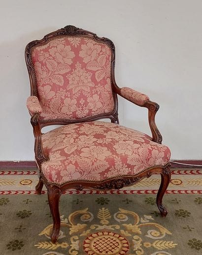 Flat-backed armchair in moulded and carved...