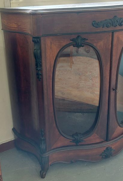 A display cabinet in natural wood, with curved...