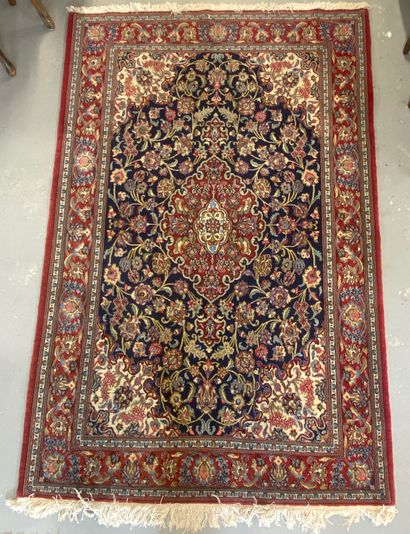 Handmade wool carpet with central medallion...