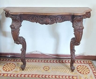 WALL CONSOLE in carved oak with curved front...