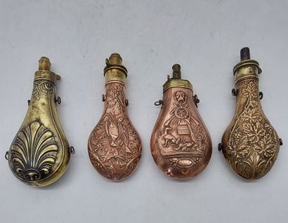 LOT OF FOUR POWDER TANKS in repoussé copper...