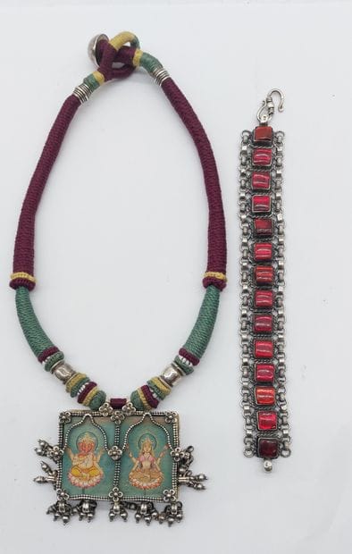 silver necklace with miniatures



One silver...