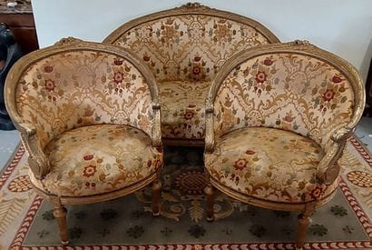 Gilded wood salon with floral fabric upholstery,...