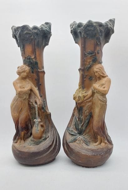 Pair of Art Nouveau plaster vases decorated...