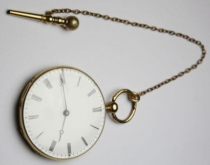 MONTRE DE GOUSSET en or jaune et sa clé....
