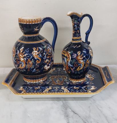 GIEN

A tray and two pourers in Gien earthenware...