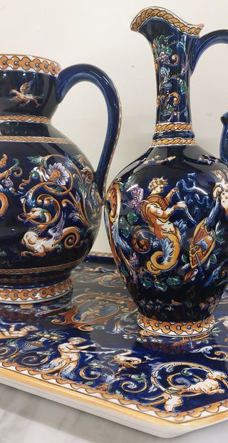 GIEN

A tray and two pourers in Gien earthenware...
