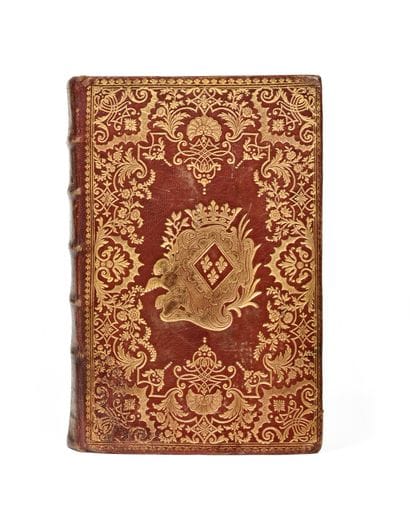 BINDING RICHLY DECORATED WITH THE COAT OF...