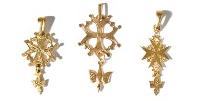 SET OF FIVE PENDANTS with Huguenot cross.
-Three...