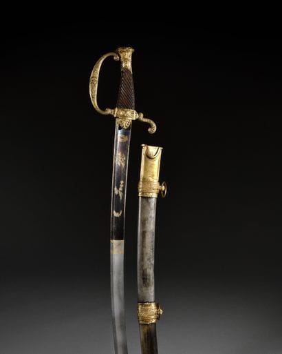 Officer type saber.
Obliquely grooved wooden...