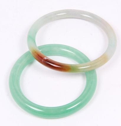 CHINA, 20th CENTURY
Set of two jadeite bracelets,...