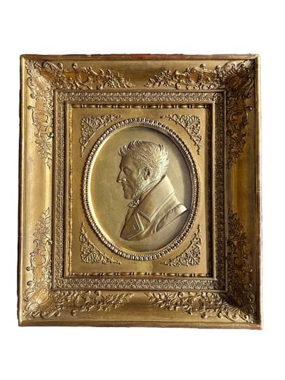 Medallion
in gilded plaster representing...
