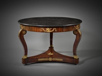 Large circular table
in mahogany and ormolu,...
