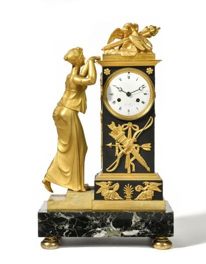 Clock
in patinated bronze and gilt bronze,...