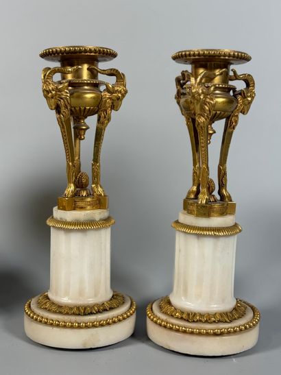 A white marble and gilt-bronze CHIMNEY CLOCK...