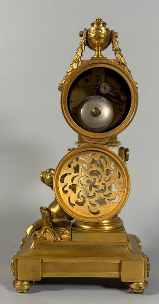 A white marble and gilt-bronze CHIMNEY CLOCK...