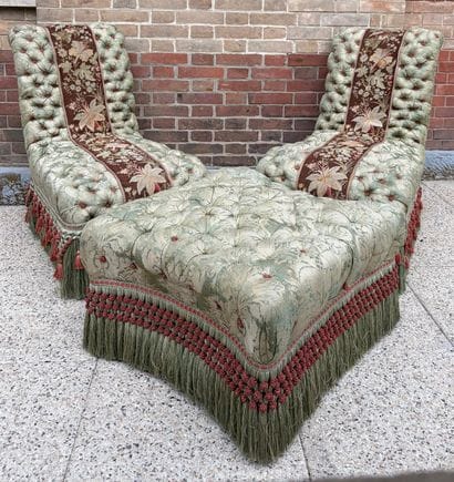 PAIR OF CHAUFFEUSES matched with a POUF upholstered...